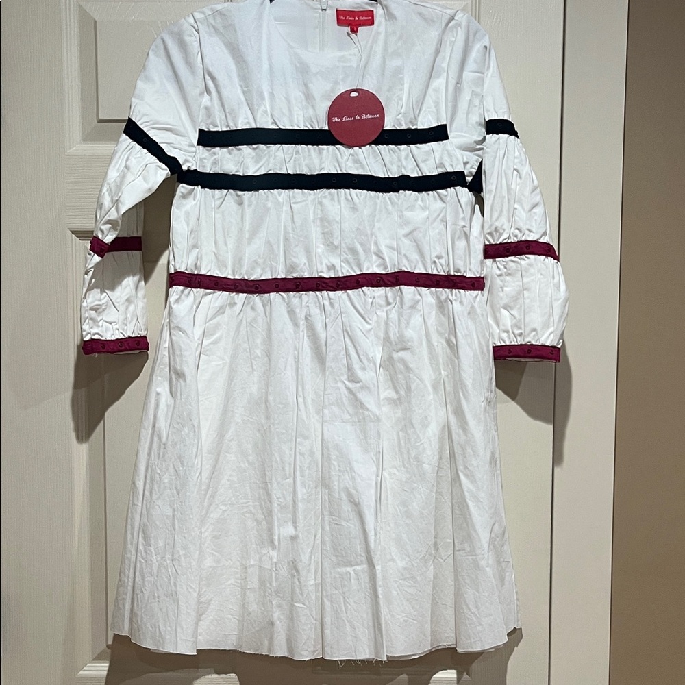 Elegant White Dress with Black and Red Accents